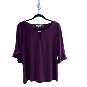 Calvin Klein plum colored jersey top, szL, gold signature bar at neckline,knit